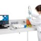 Lab technician uses Raman technology to monitor their process