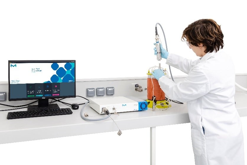 Lab technician uses Raman technology to monitor their process